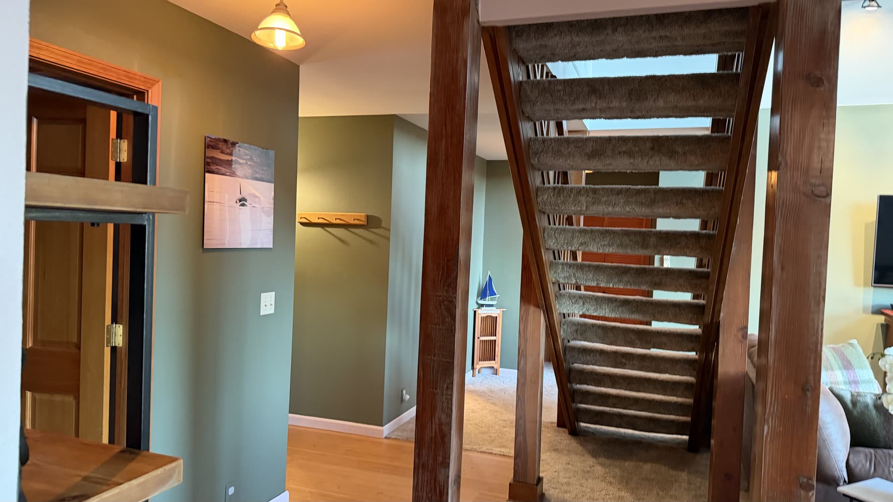Open timber staircase leading to the upper level